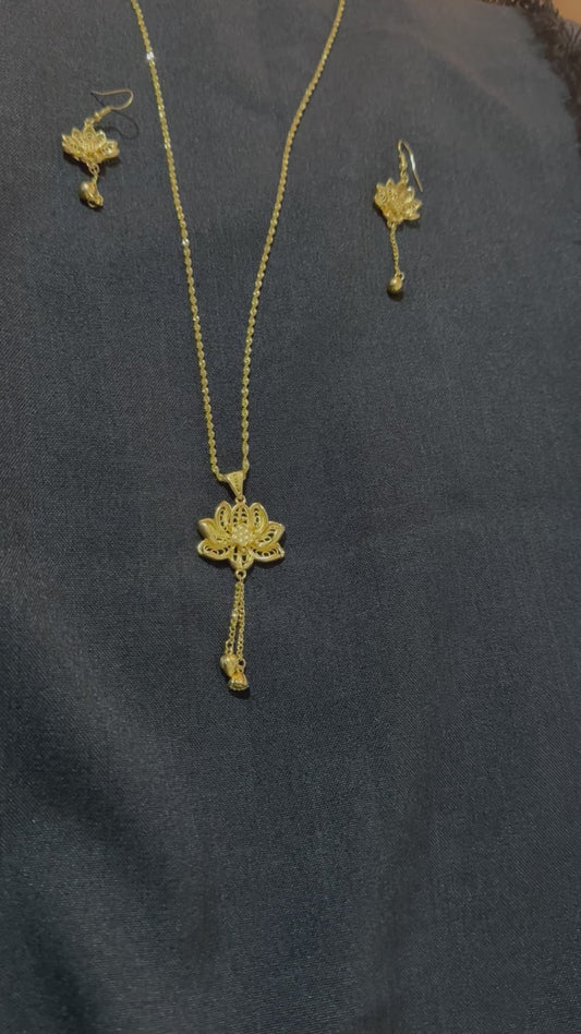 Gold look necklace with small hibiscus pendant and matching earrings